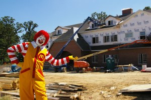 Ronald McDonald House -- the place one most fears winding up at. Open upper storey windows reveal escaped inmates. Tyvek for Mayor.